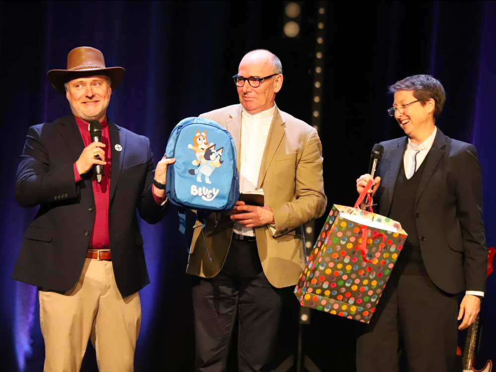 Image: Gafcon's Secretary General Paul Donison (left) farewelled with a Bluey backpack and Akubra by Peter Smith and Jen Hercott.