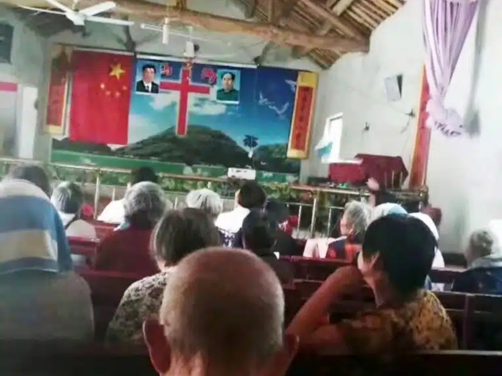 Images of Mao and Xi flank a cross in a Chinese church