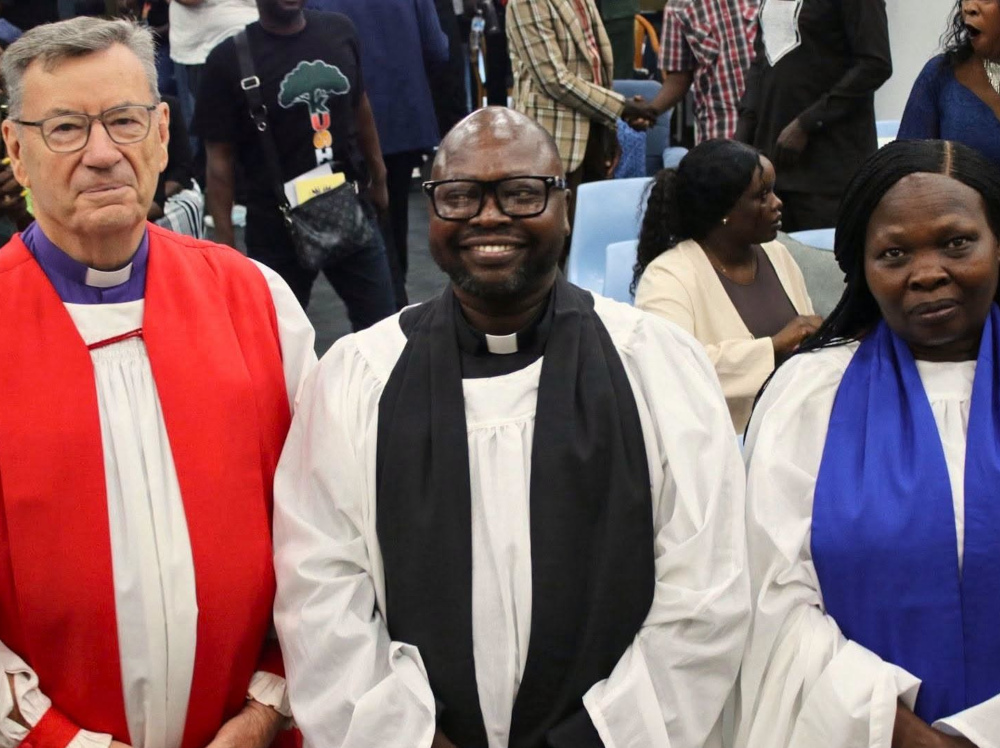Mekyal Kiera (centre) being ordained as deacon